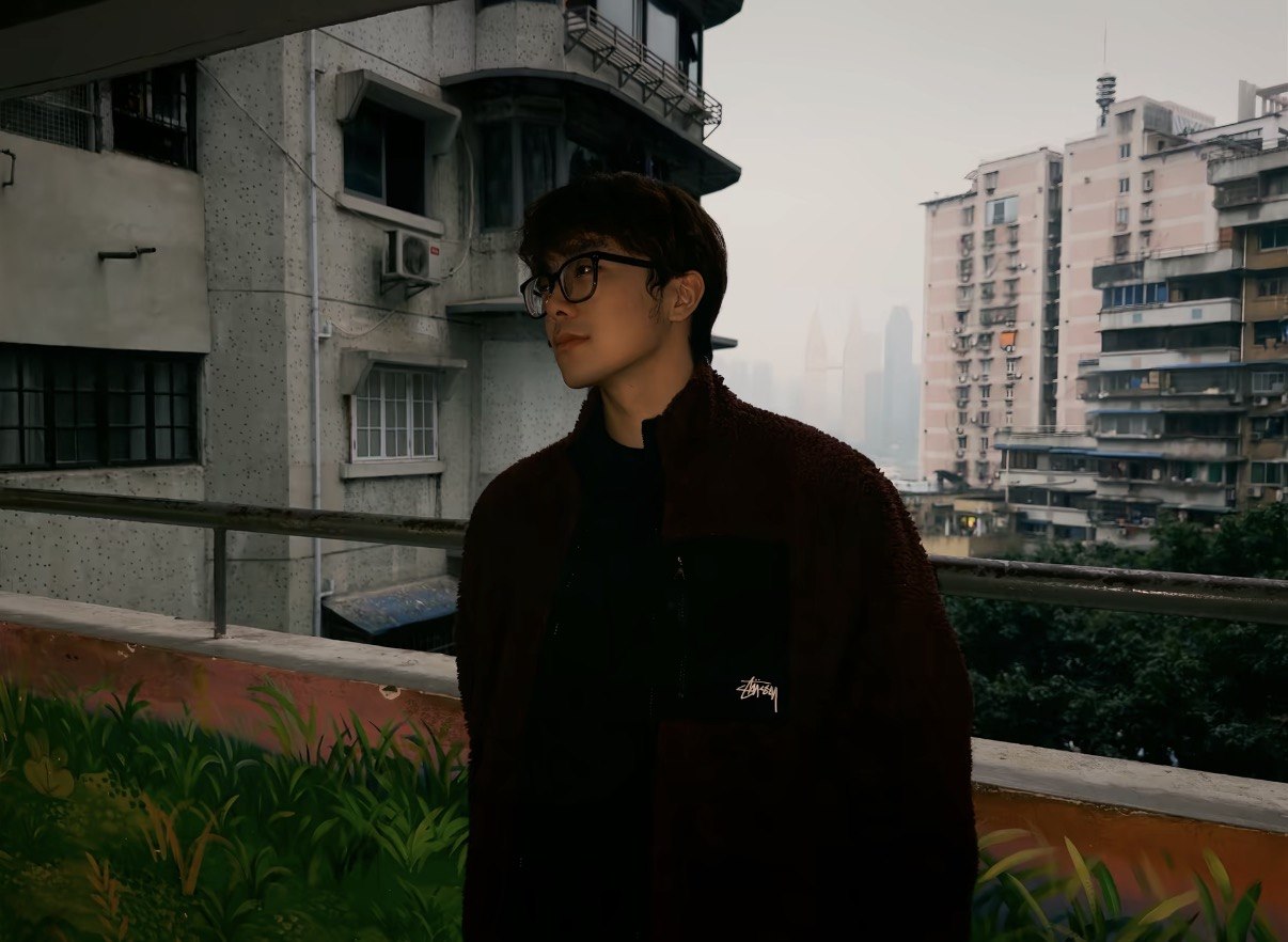 Zhenye Lou in an urban evening setting