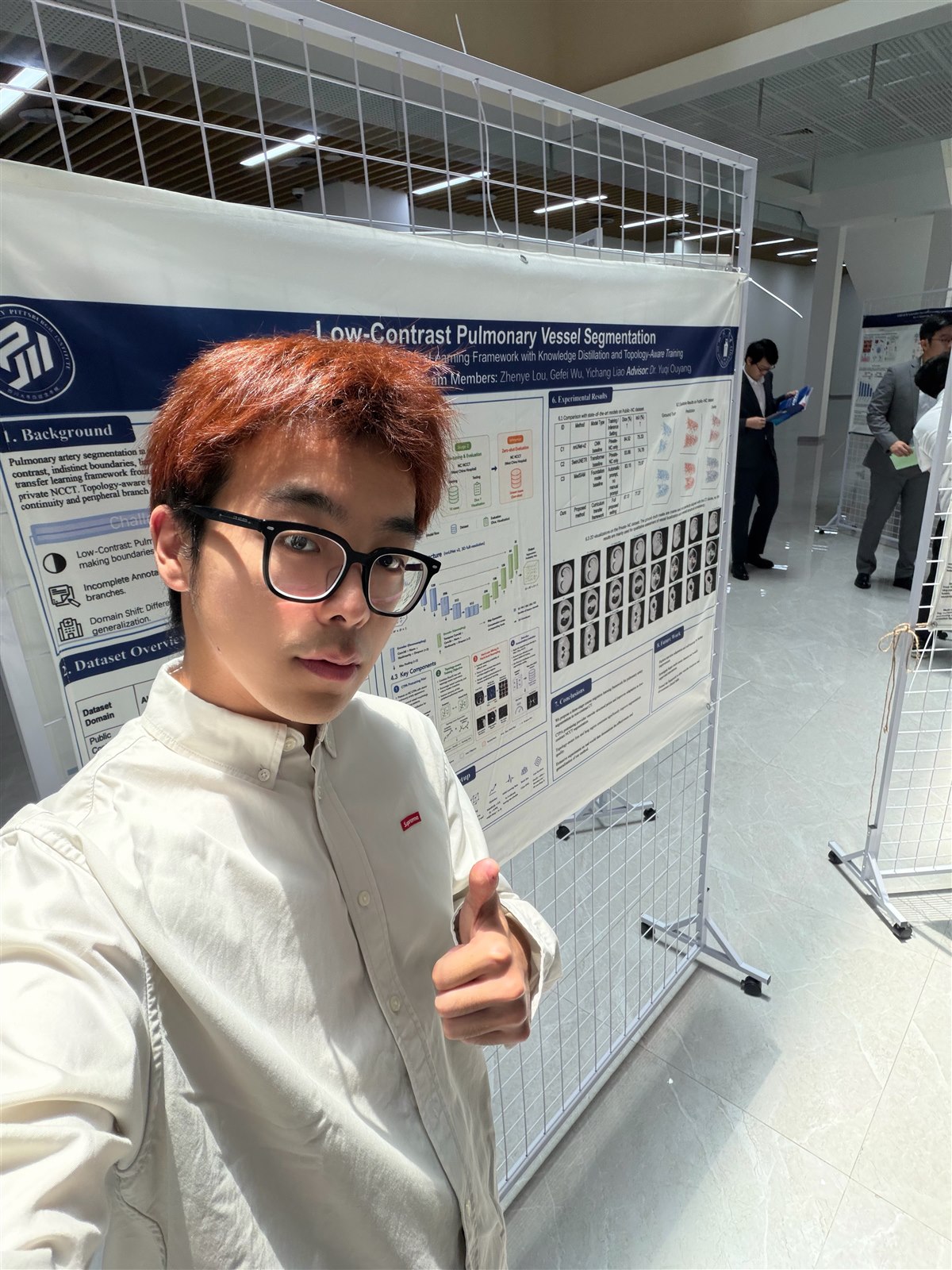 Zhenye Lou presenting a research poster